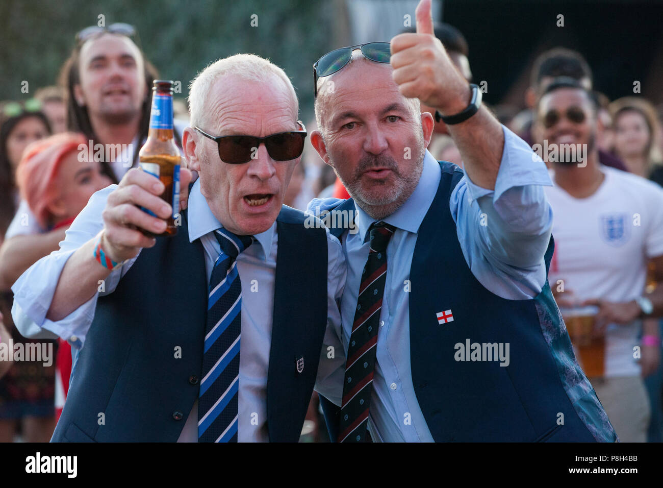 London, UK. 11th July, 2018. England fans in Gareth Southgate waistcoats attend the public screening of the FIFA 2018 World Cup semi-final between England and Croatia in Hyde Park, the largest such screening of a football match since 1996. The event was organised by the Mayor of London and Government in conjunction with the Royal Parks, the Football Association and other agencies. The match provides England with the chance to reach their first World Cup final since 1966. Credit: Mark Kerrison/Alamy Live News Stock Photo