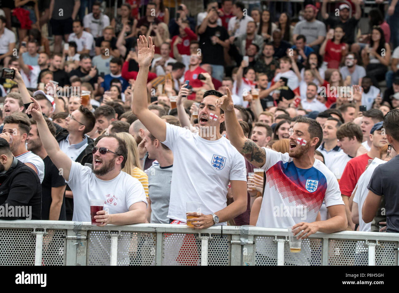 Castlefield Bowl, Manchester, UK. 11th July 2018. Football fans sing
