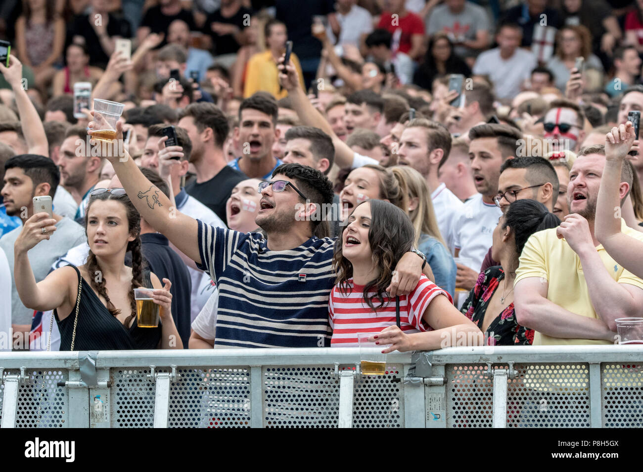 Castlefield Bowl, Manchester, UK. 11th July 2018. Football fans sing