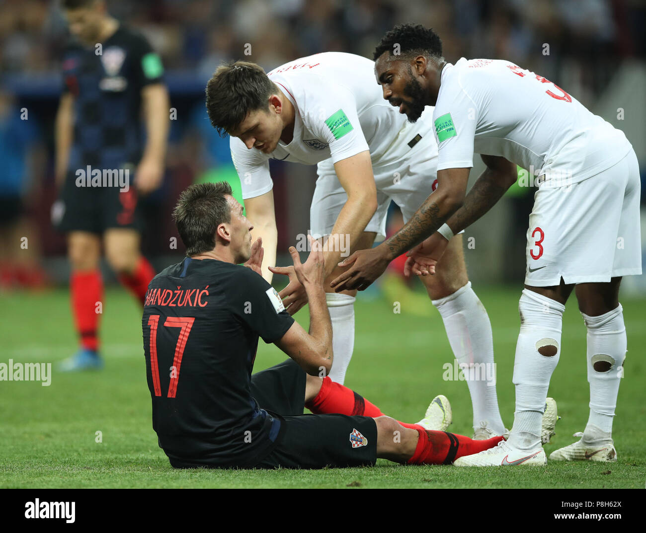 Moscow, Russia. 11th July, 2018. England's Danny Rose (R top) and Harry Maguire (L top) talk with Mario Mandzukic of Croatia during the 2018 FIFA World Cup semi-final match between England and Croatia in Moscow, Russia, July 11, 2018. Croatia won 2-1 and advanced to the final. Credit: Wu Zhuang/Xinhua/Alamy Live News Stock Photo