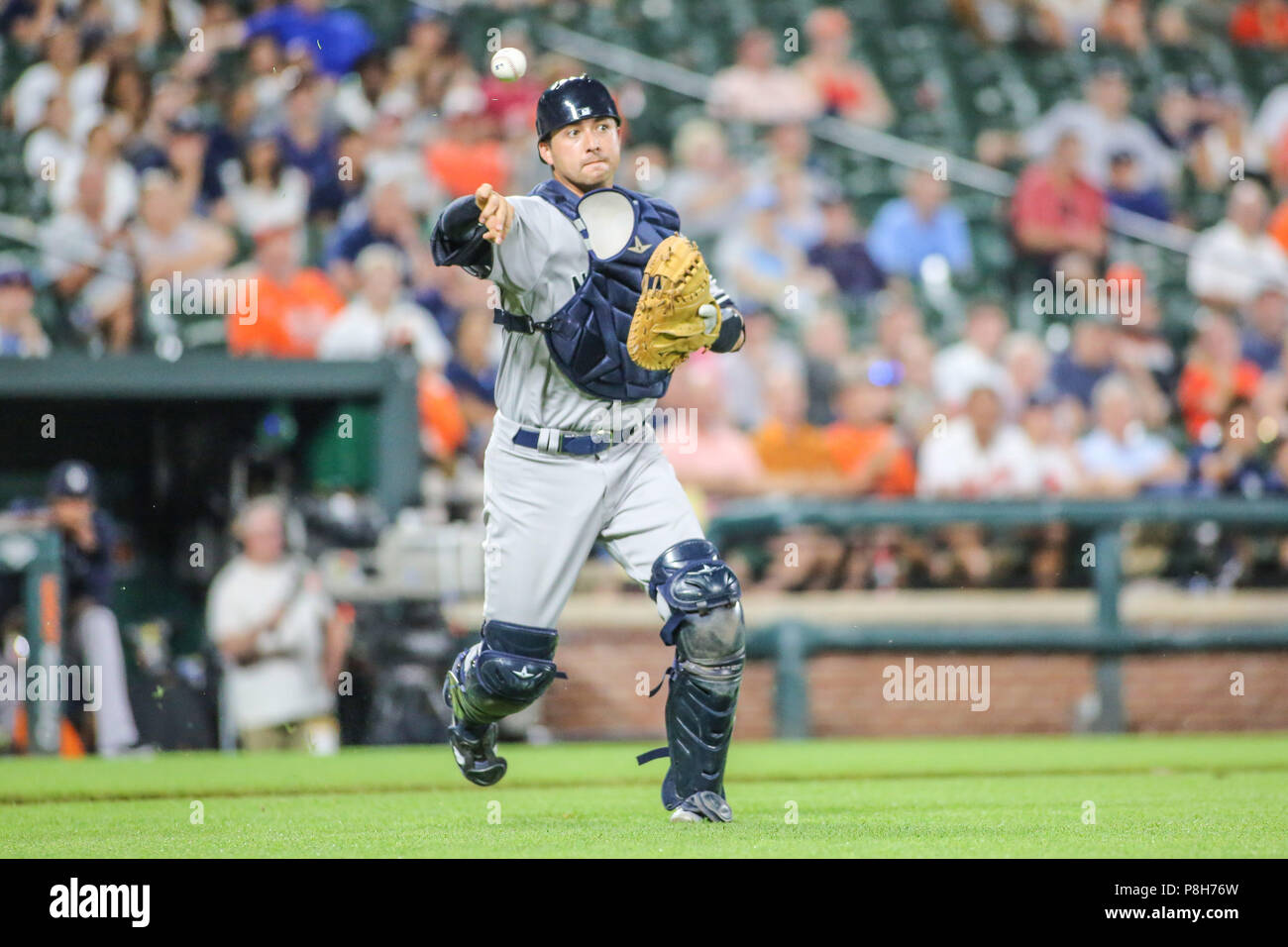 Baltimore, MD, USA. 11th July, 2018. New York Yankees catcher Kyle  Higashioka (66) throws a runner out in the 8th inning during MLB action  between the New York Yankees and the Baltimore