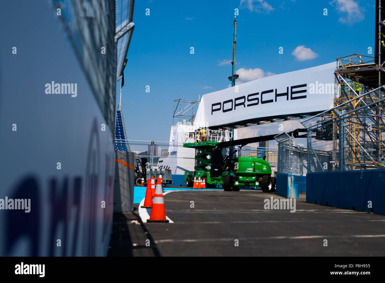 New York, USA. 11th July, 2018. A Porsche advertising banner being readied as preparations continue ahead of the 2018 NYC E-Prix. Credit: Lou Johnson / Spacesuit Media. Credit: Spacesuit Media/Alamy Live News Stock Photo