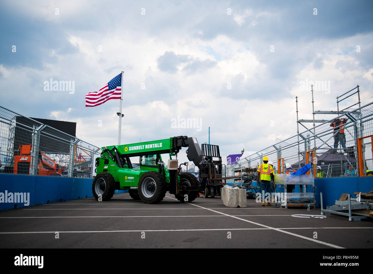 New York, USA. 11th July, 2018. A telehandler at work as preparations continue ahead of the 2018 NYC E-Prix. Credit: Lou Johnson / Spacesuit Media. Credit: Spacesuit Media/Alamy Live News Stock Photo