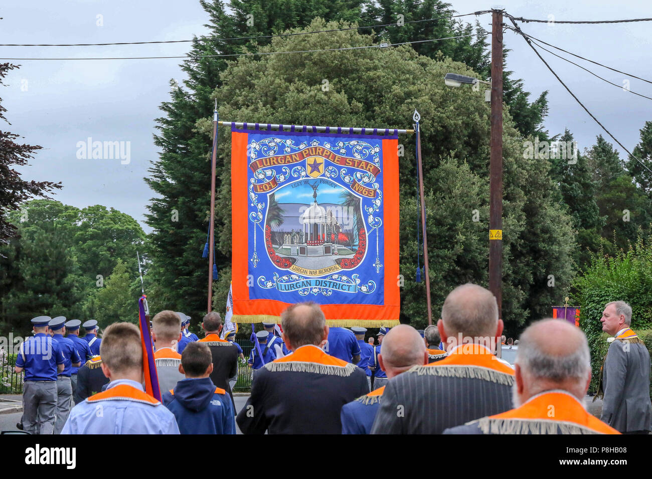 Lurgan, County Armagh, Northern Ireland.12 July 2018. The Twelfth of July is marked by Orange Order parades across Northern Ireland. Lurgan District leave their headquarters at Brownlow House before parading up the town to the war memorial and then head to Loughgall for the main County Armagh demonstration. The parades across Northern Ireland mark the victory of William of Orange over James at the Battle of the Boyne in 1690. Credit: CAZIMB/Alamy Live News. Stock Photo