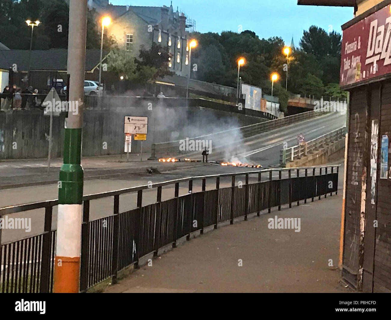 A fire at the bottom of the flyover in the Bogside after youths armed with petrol bombs and stones threw missiles into the nearby unionist Fountain estate. Stock Photo