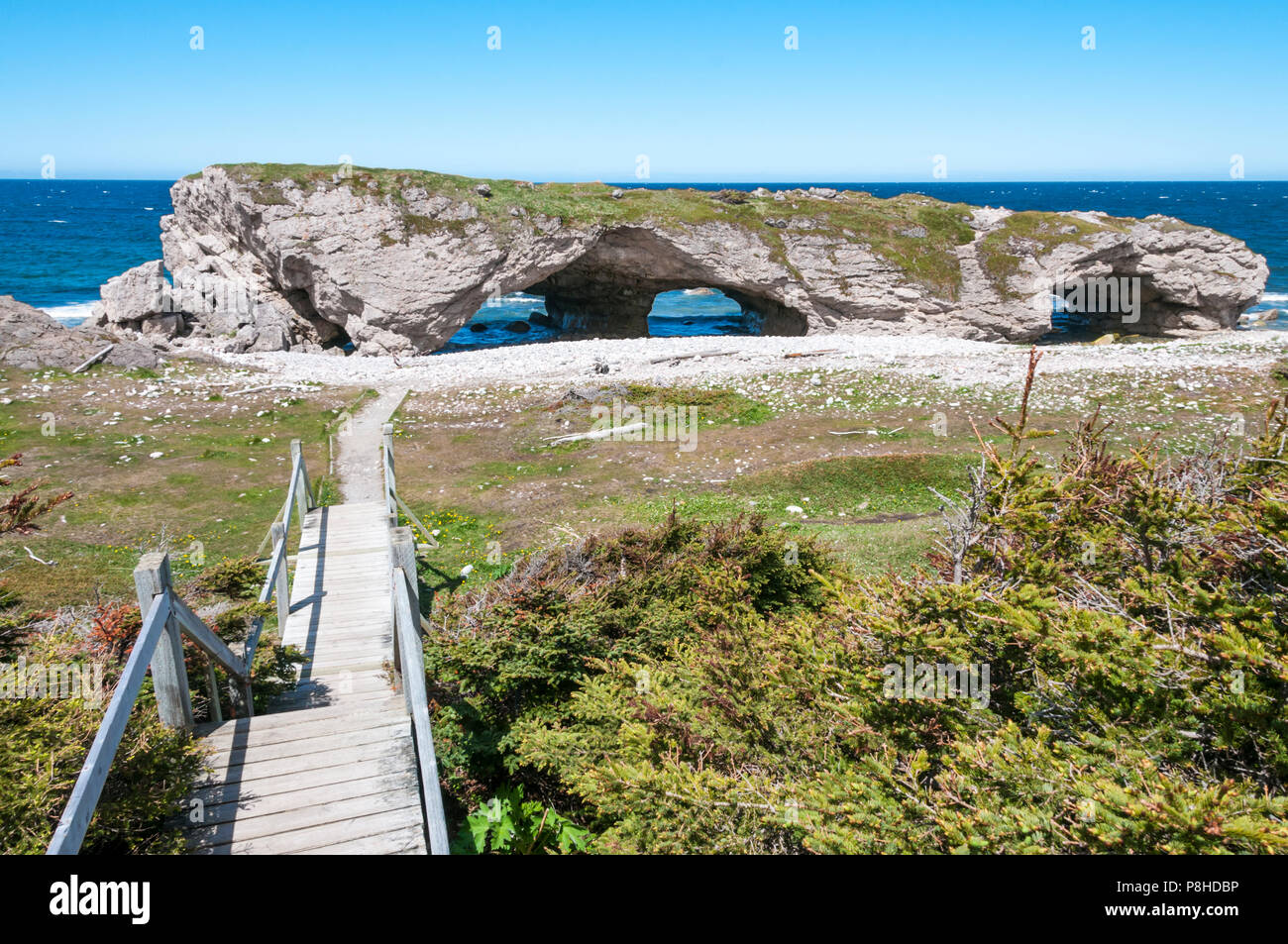 Natural rock arch of Arches Provincial Park at Portland Creek on the coast of Newfoundland's Northern Peninsula on the Gulf of St Lawrence Stock Photo