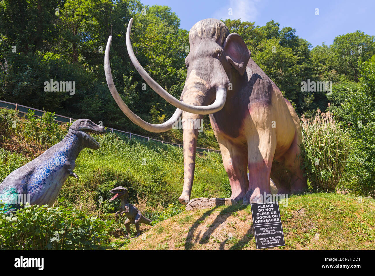 Dinosaurs in the Prehistoric Dinosaur Valley at Wookey Hole, Wells, Somerset, UK in July Stock Photo