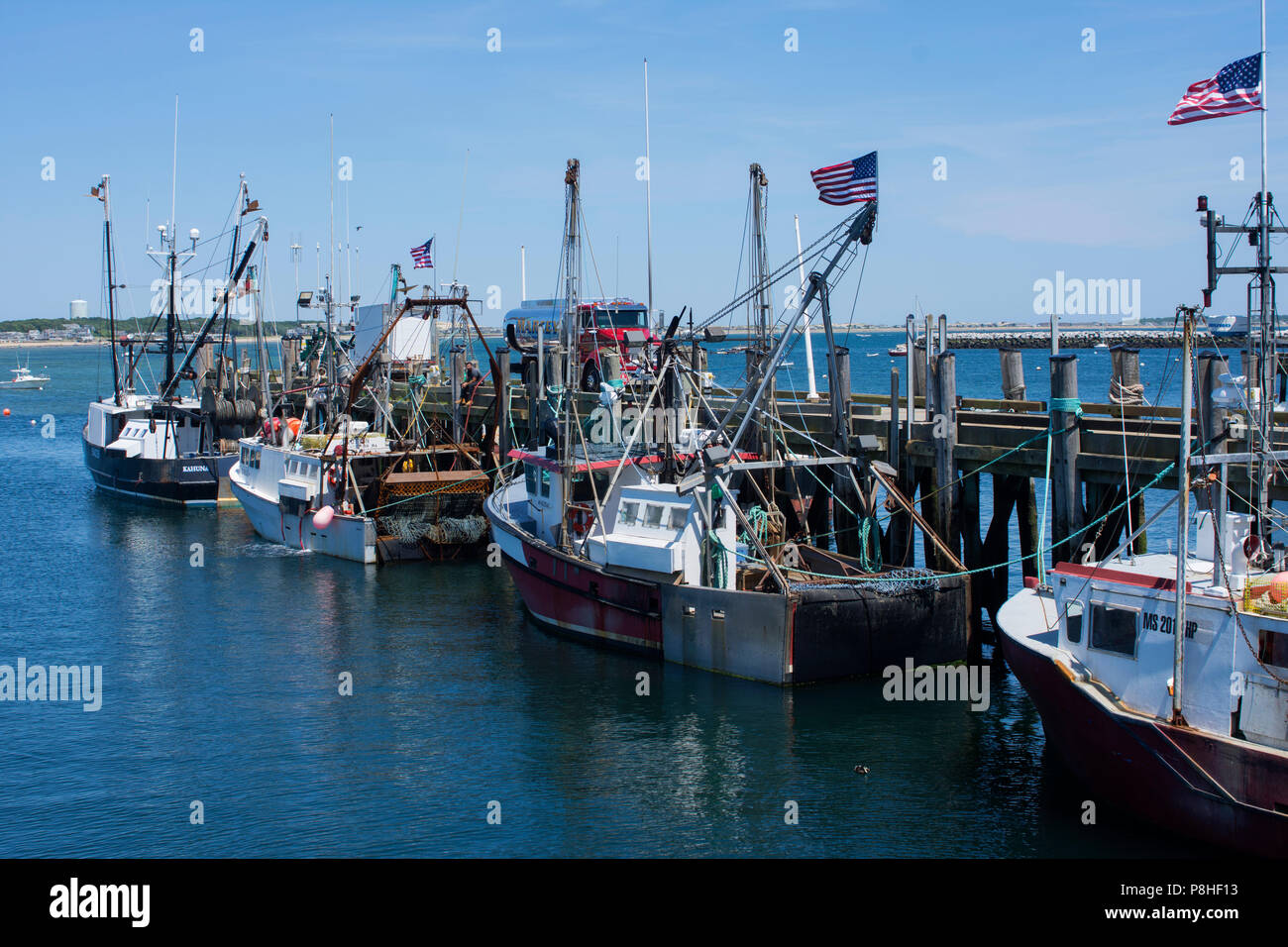 Fishing trawlers along the pier in Provincetown, Massachusetts, on Cape Cod, USA Stock Photo