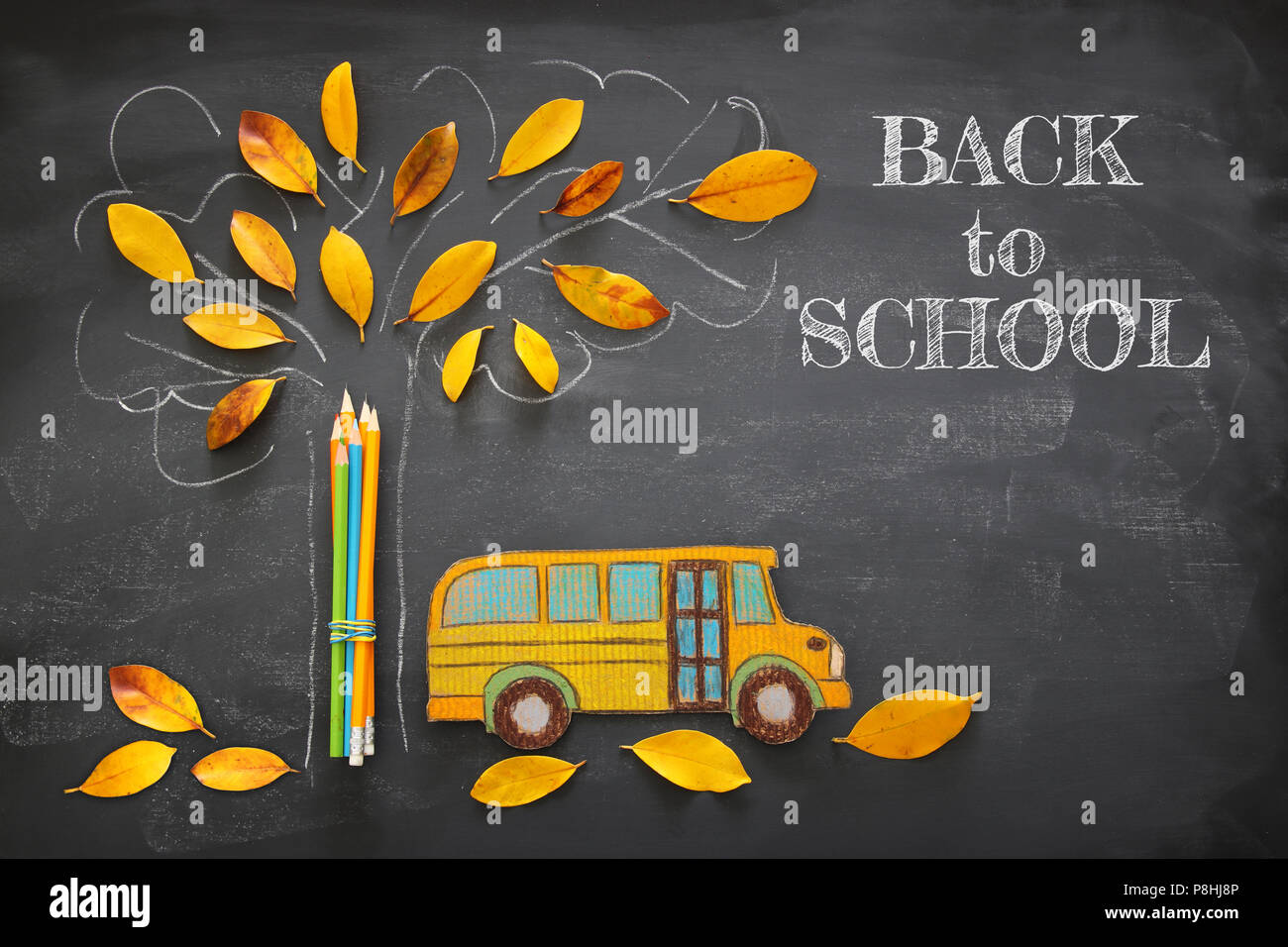 Back to school concept. Top view image of school bus and pencils next ...
