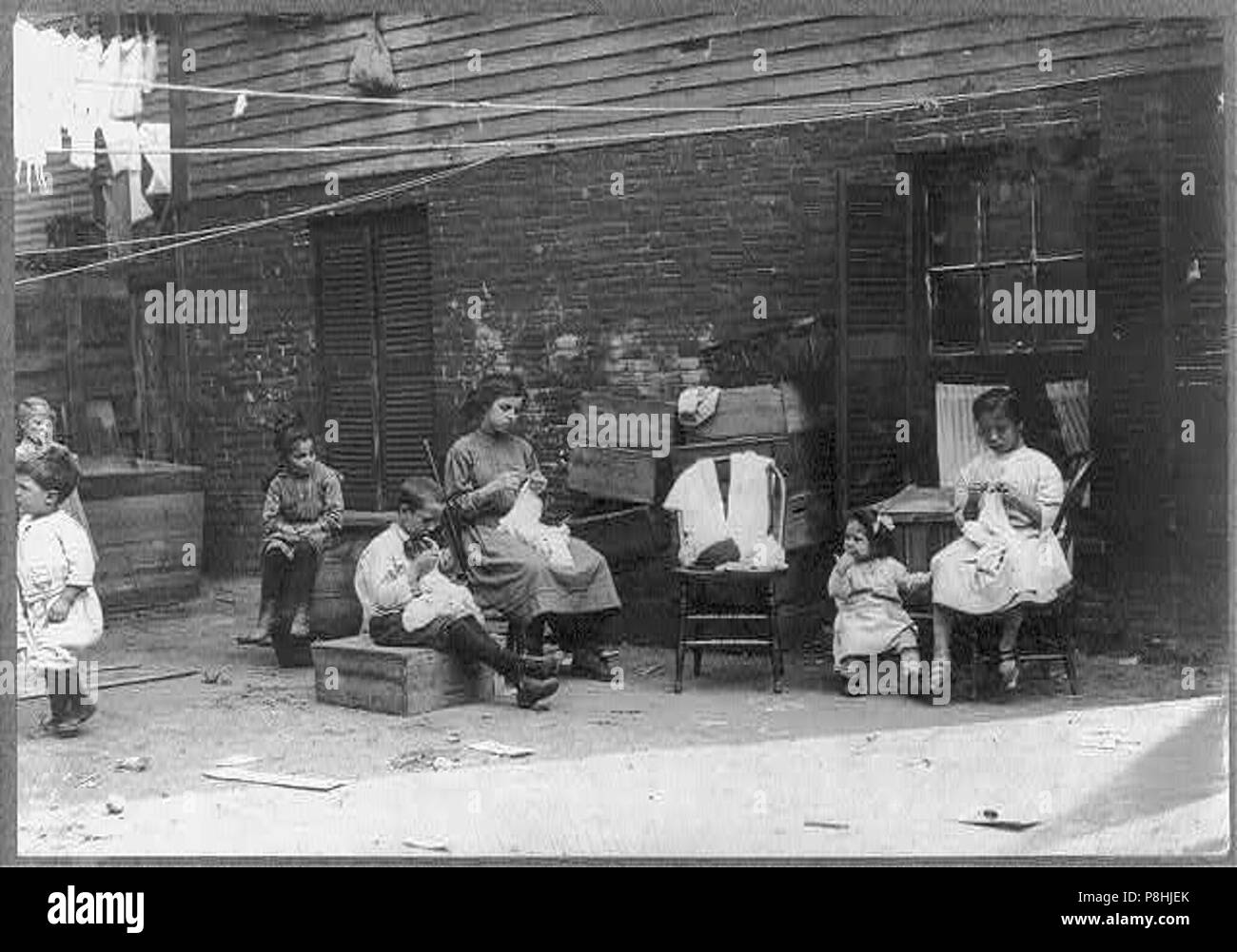 A 9 year old boy Jo Cafarella 39 Warren Street Somerville Mass. His sister Lena 10 years and Mary Lazzaro 13 years old his cousin lives at 17 South Street. This is typical of their Stock Photo