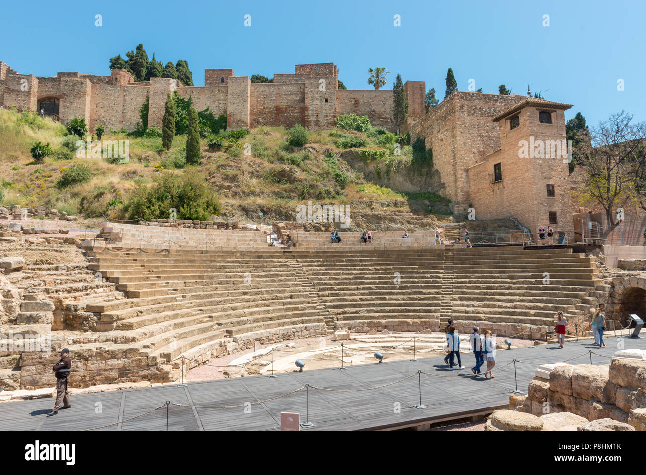 Tourists visiting the Roman theater Alcazaba de M??laga, Andalusia