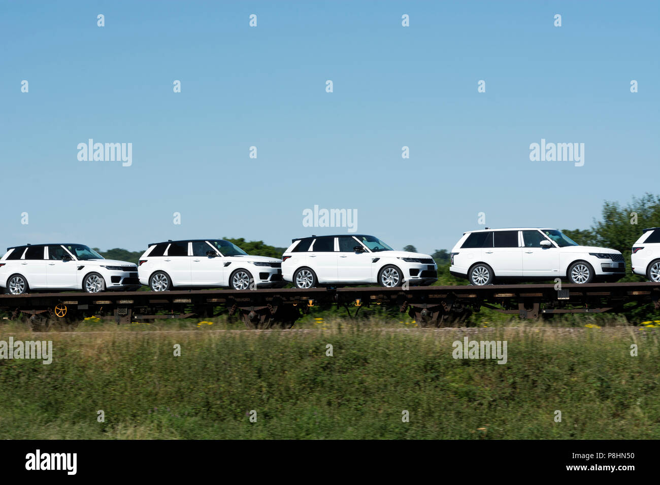 New Land Rover cars transported by rail, Warwickshire, UK Stock Photo