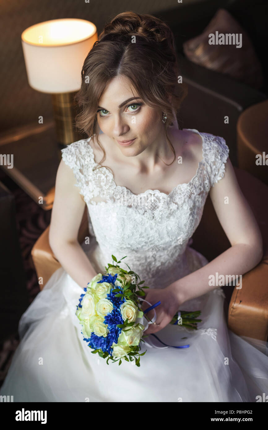 Bride sitting on chair hi-res stock photography and images - Alamy