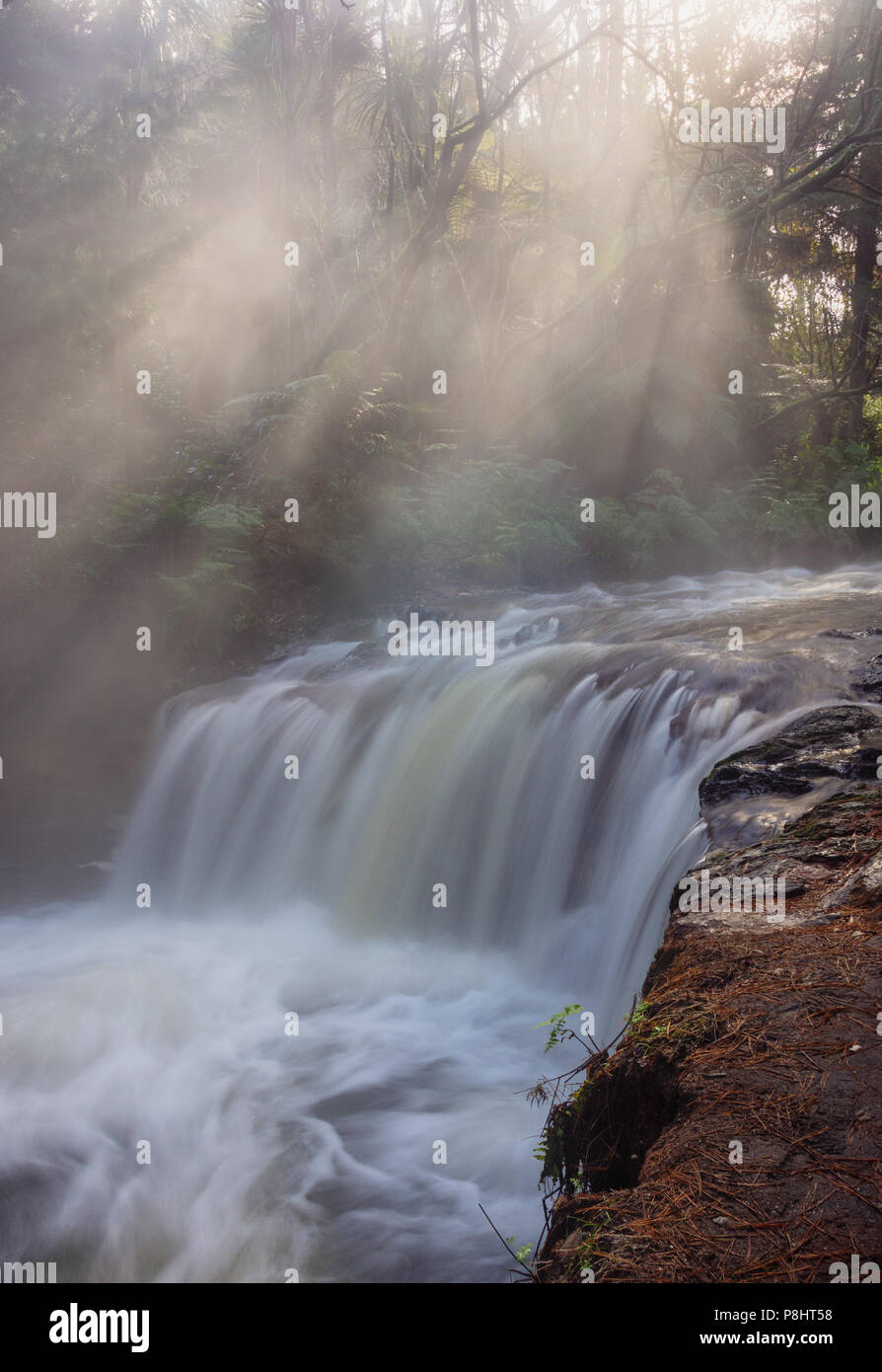 beautiful waterfall in rays of sunshine, New Zealand Stock Photo