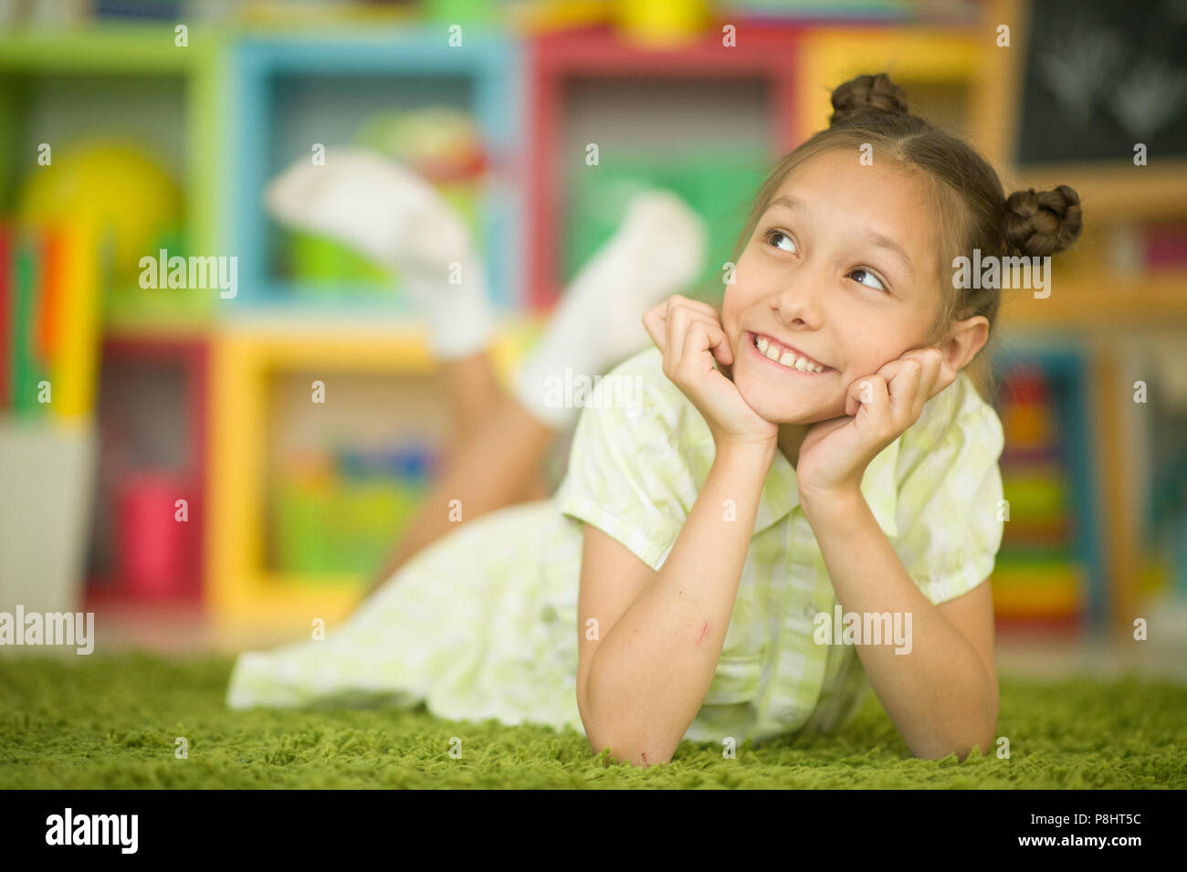 Cute girl in green dress Stock Photo - Alamy