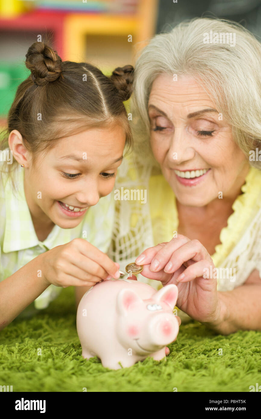 old woman with piggy bank Stock Photo - Alamy
