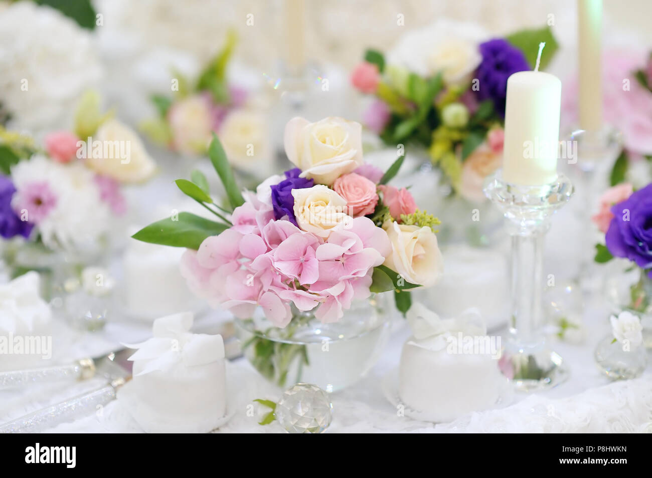 Beautiful pink roses in small vases and other decorations Stock Photo ...