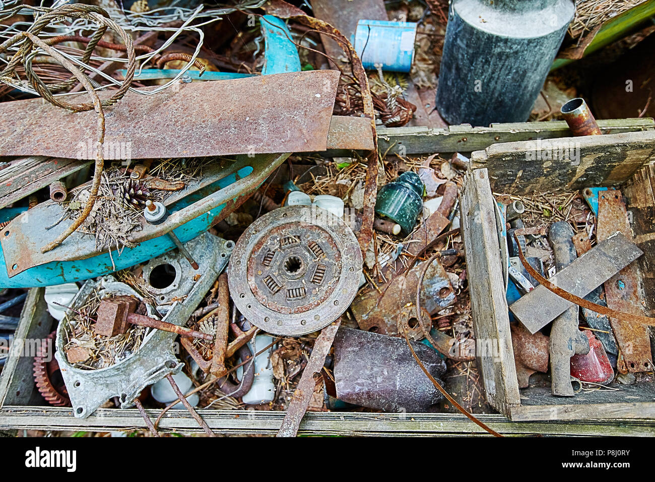 Dump old metal objects in the woods, rusty scrap metal. Environmental