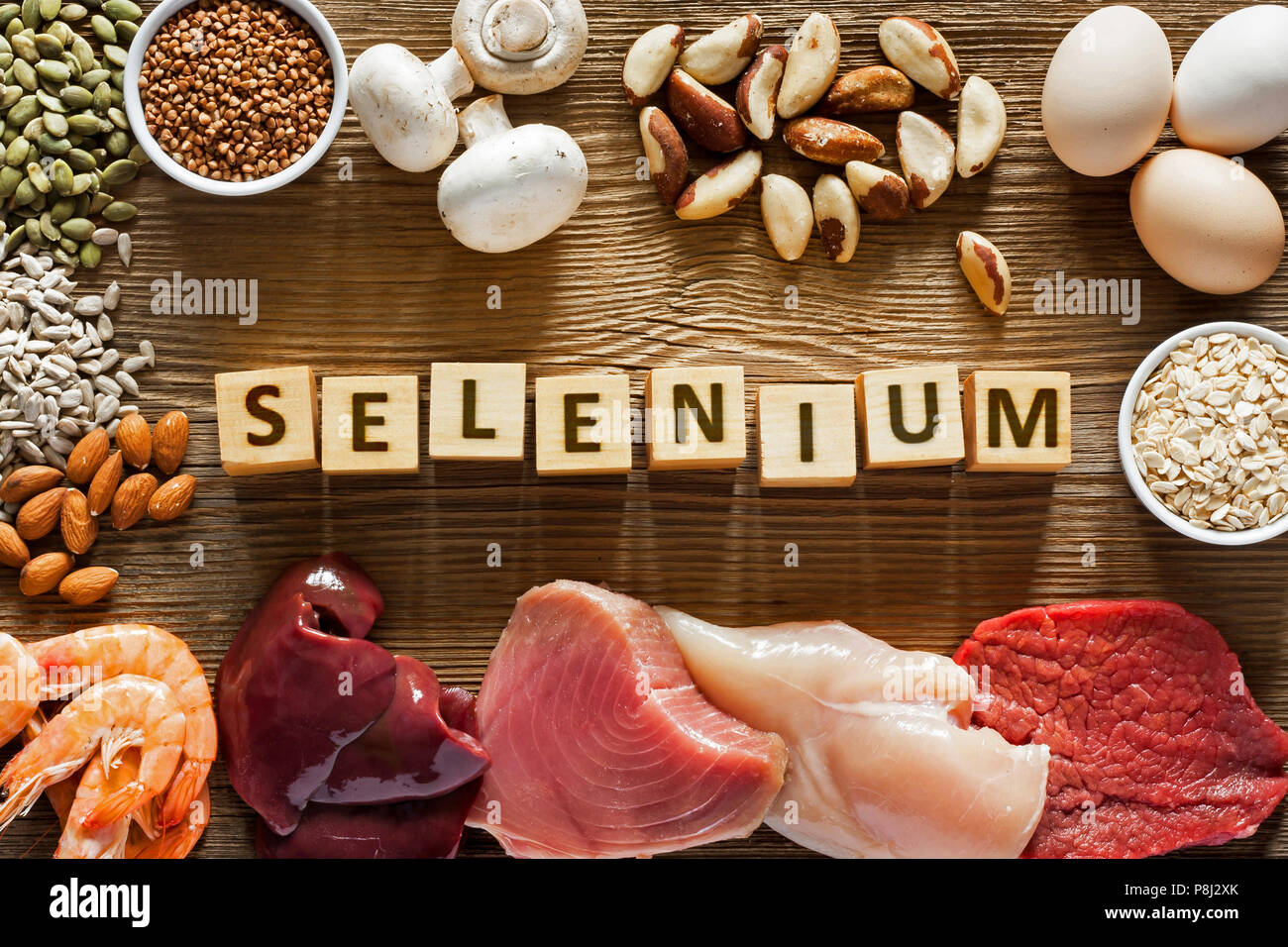 Foods High in Selenium as brasil nuts, tuna, shrimps, beef, liver, mushrooms, pumpkin seeds, sunflower seeds, buckwheat, oatmeal, almonds and eggs. To Stock Photo