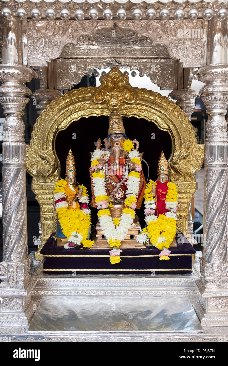 An ornate statue of the Hindu god Ganesha inside the Hindu Temple Society in Flushing, Queens, New York City. Stock Photo