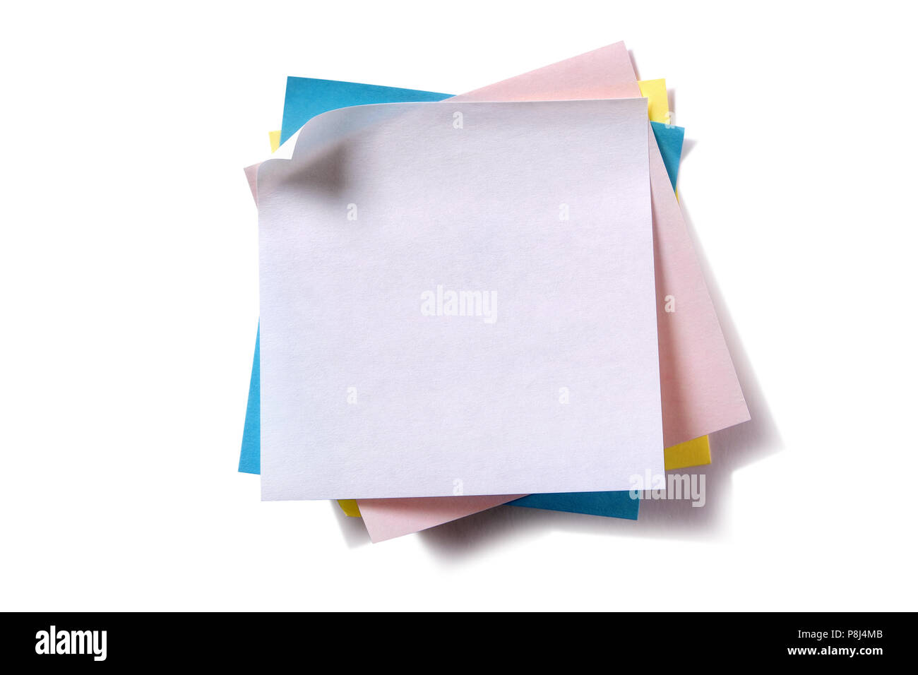 Untidy pile various colors sticky post notes isolated on white Stock Photo