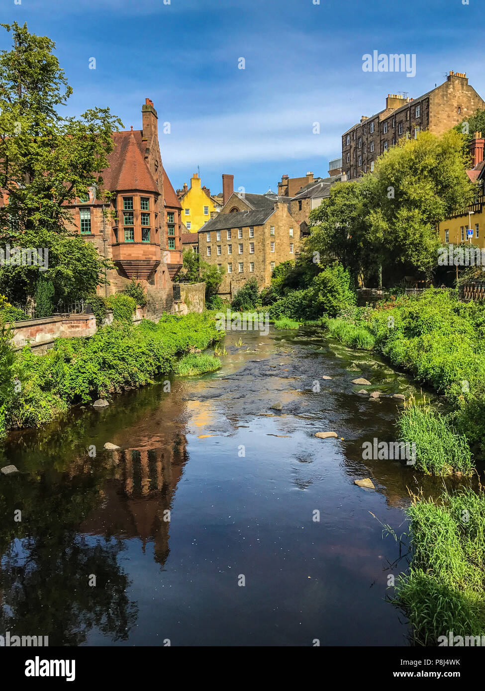 Historic and picturesque Dean Village in Edinburgh Scotland with Water of Leith flowing through it Stock Photo