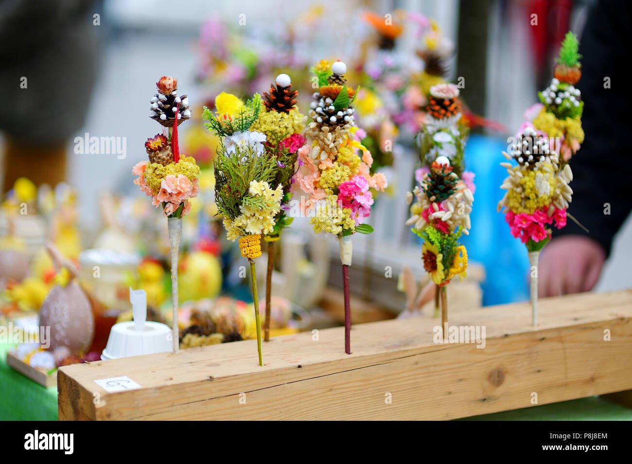 Traditional lithuanian Easter decorative palm bouquets sold on spring market Stock Photo