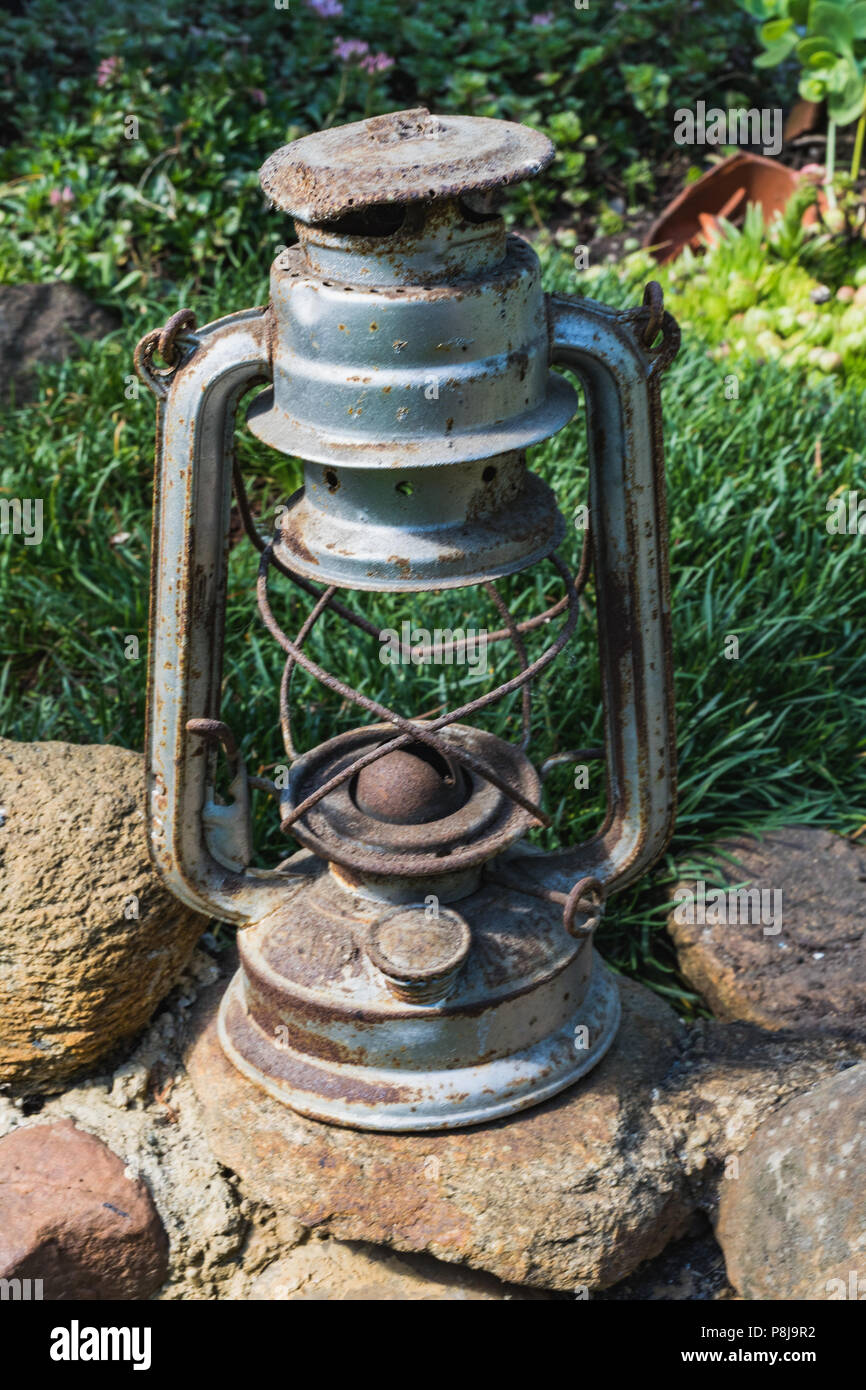 old rustic oil lantern as decoration in a garden in germany Stock Photo -  Alamy