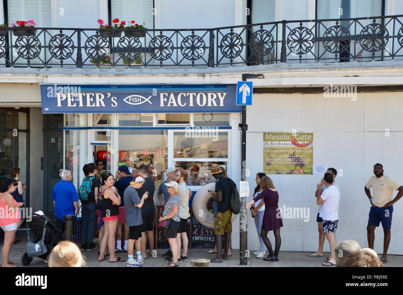people queuing at peters fish factory fish and chip shop margate kent