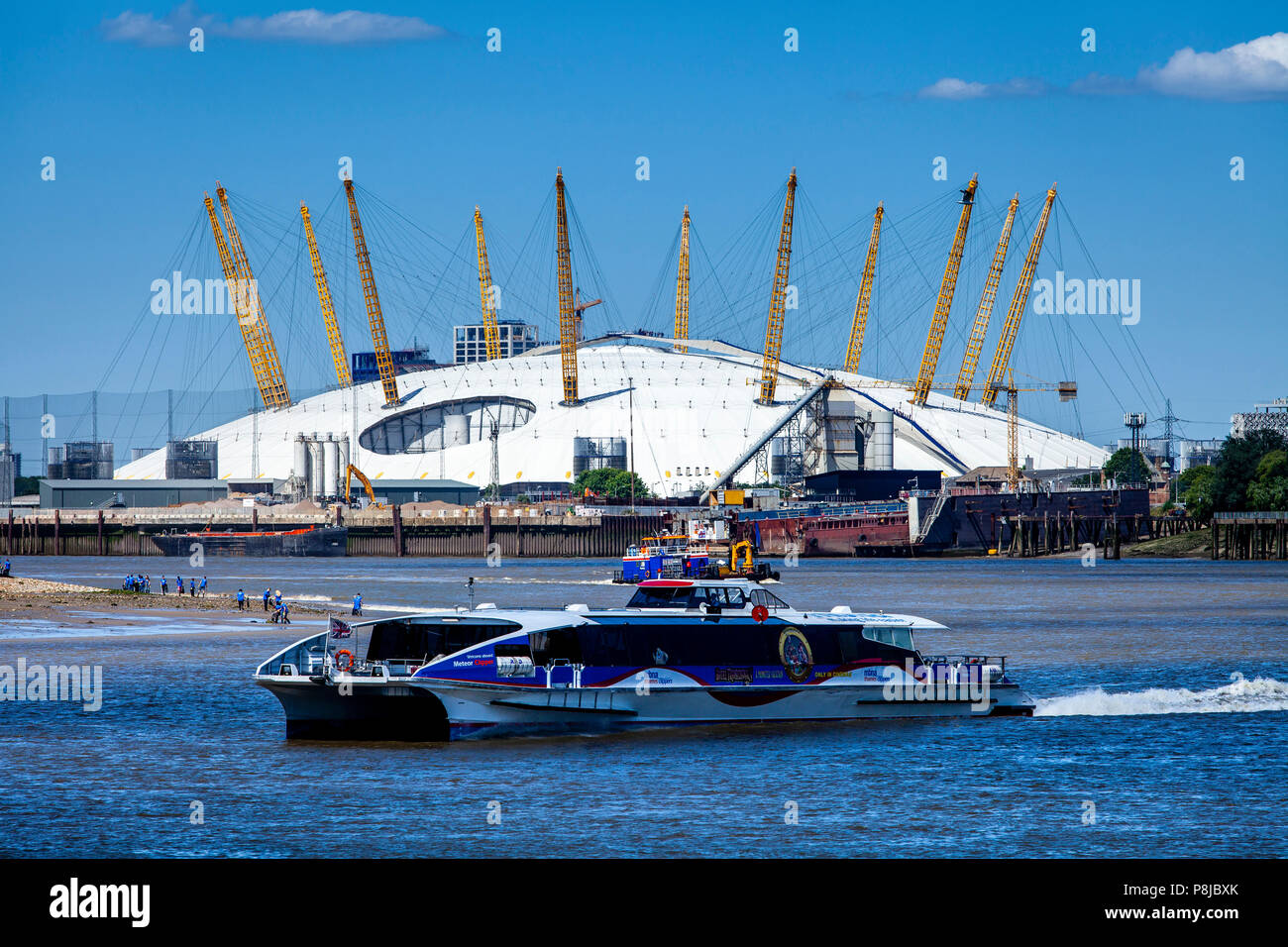 A Thames Clipper On The River Thames With The O2 Arena In The Backround, London, England Stock Photo