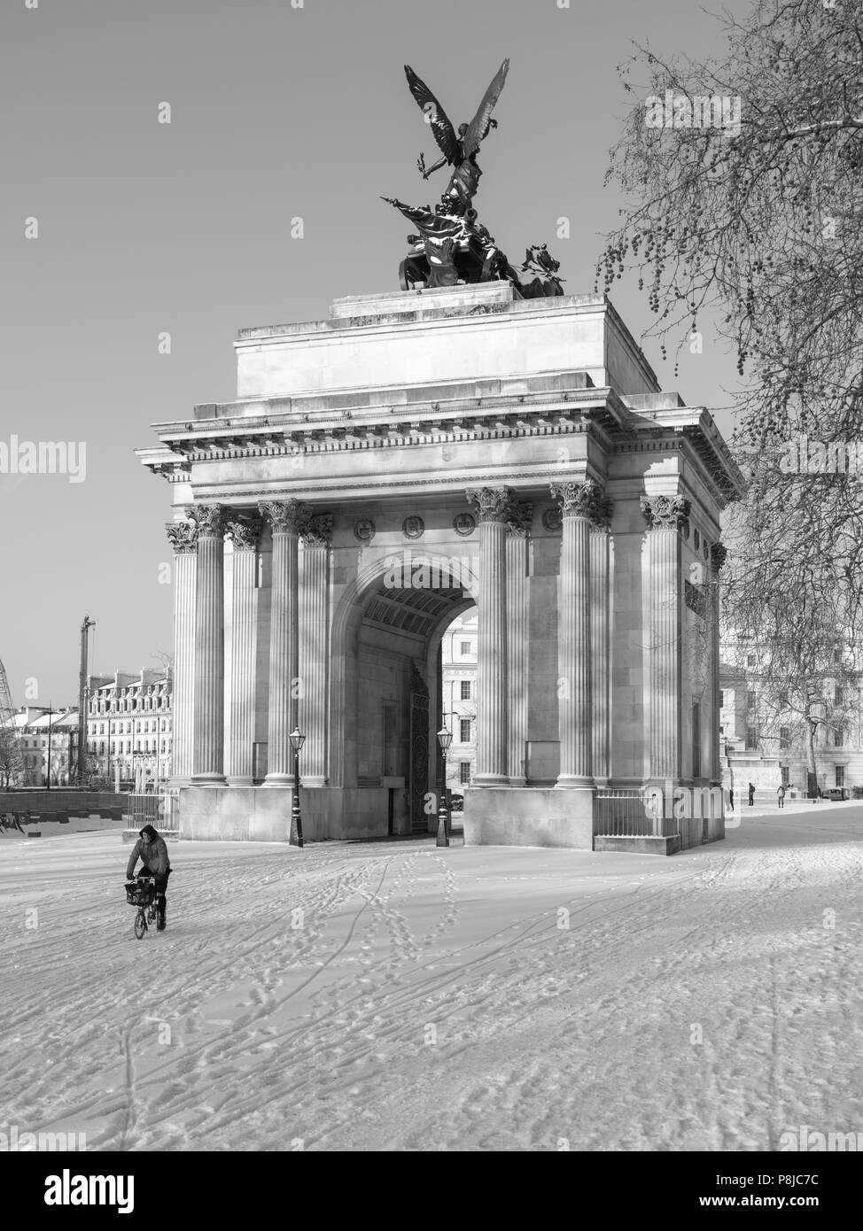 Wellington Arch London in the snow with cyclist in snow Stock Photo