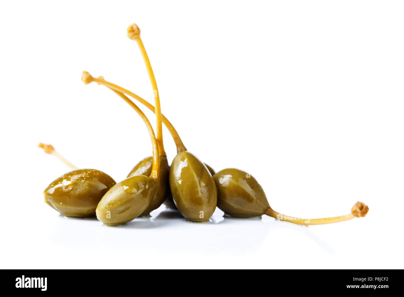 Pickled caper berries isolated on white background . Edible fruits of