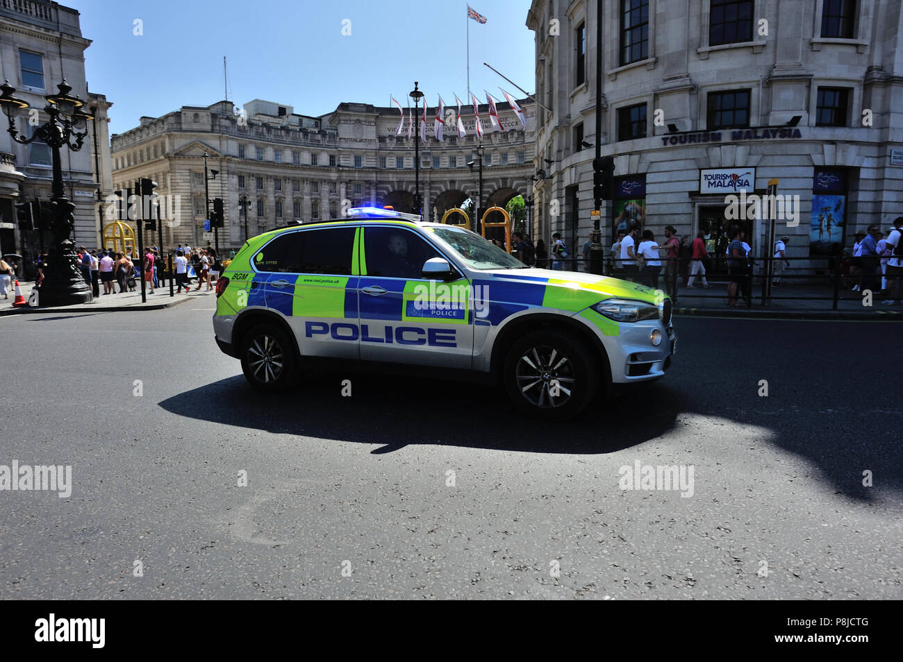 Police SUV car attending emergency with blue lights flashing, London, England, UK Stock Photo