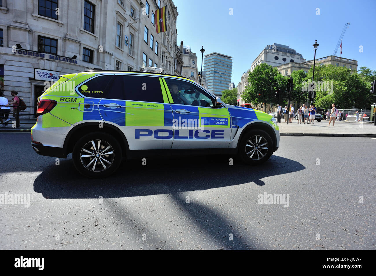 Police SUV car attending emergency with blue lights flashing, London, England, UK Stock Photo