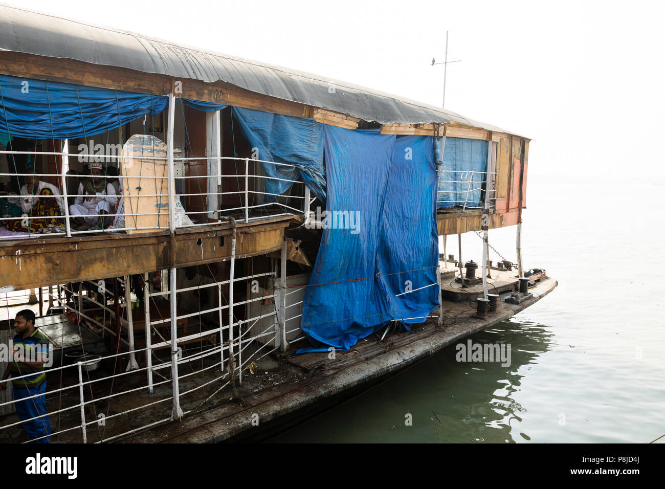 Barisal, Bangladesh, February 27 2017: The Rocket - an ancient paddle steamer had suffered a collision at the stern. The damage is now covered with a  Stock Photo