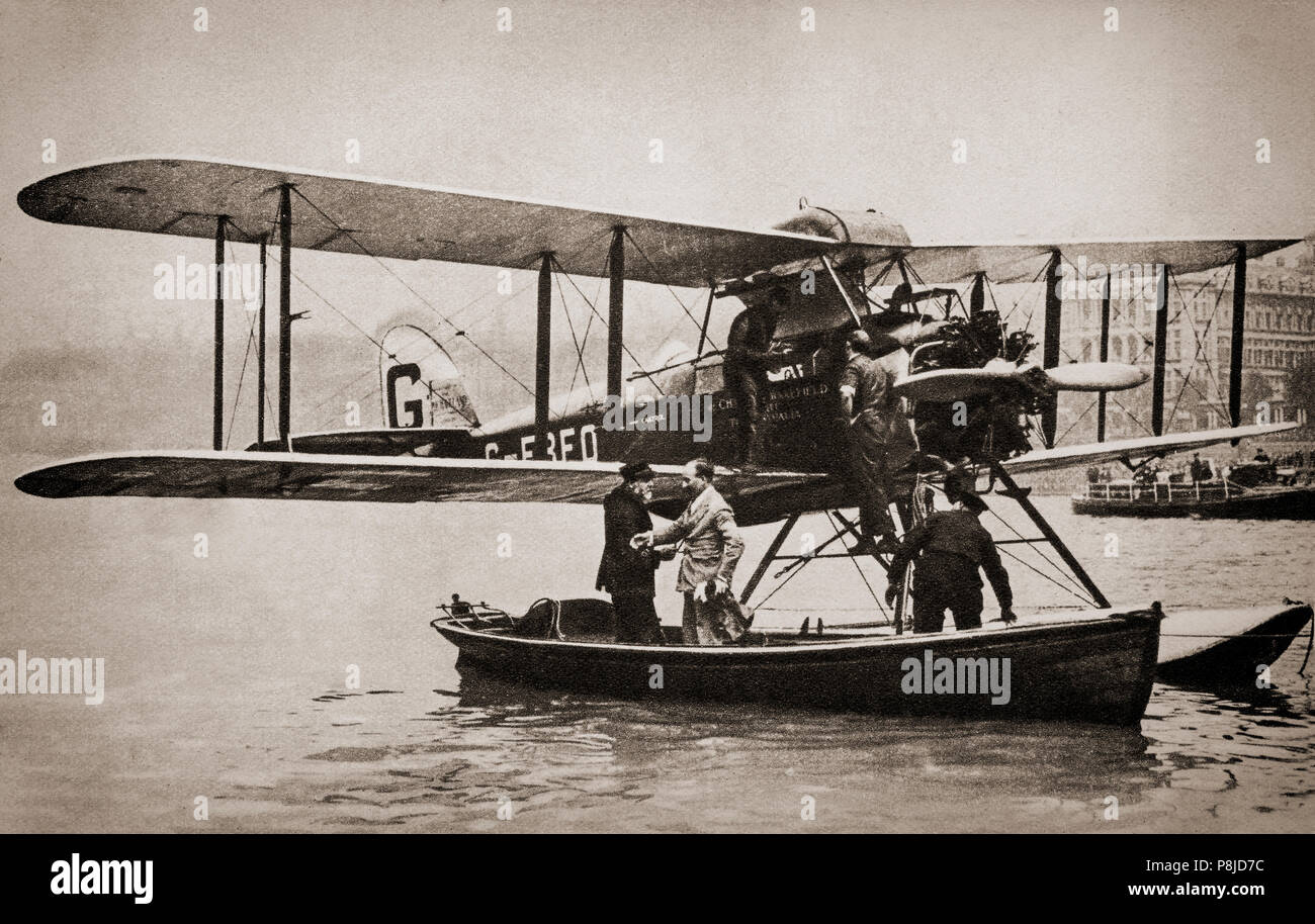 Sir Alan Cobham, pioneering aviator landing on the River Thames in Westminster, London on his return from Australia on 1 October 1926.  He left Rochester, England in his de Havilland DH.50 floatplane on 30 June 1926 for the outward flight to Australia, a journey had spanned 47 days and over 13,000 miles when he reached Melbourne, Australia on 15 August 1926.  Following his return he personally delivered a petition to Parliament about the benefits and importance of civil aviation to the nation, later receiving a knighthood for his pioneering journey. Stock Photo
