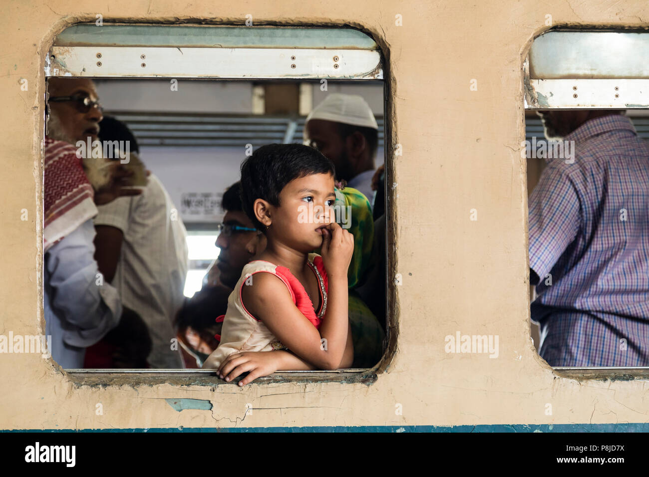 Khulna, Bangladesh, February 28 2017: A young girl looks out of the train window in the train station of Khulna Stock Photo - Alamy Khulna, Bangladesh, February 28 2017: A young girl looks out of the train window in the train station of Khulna Stock Photo - Alamy