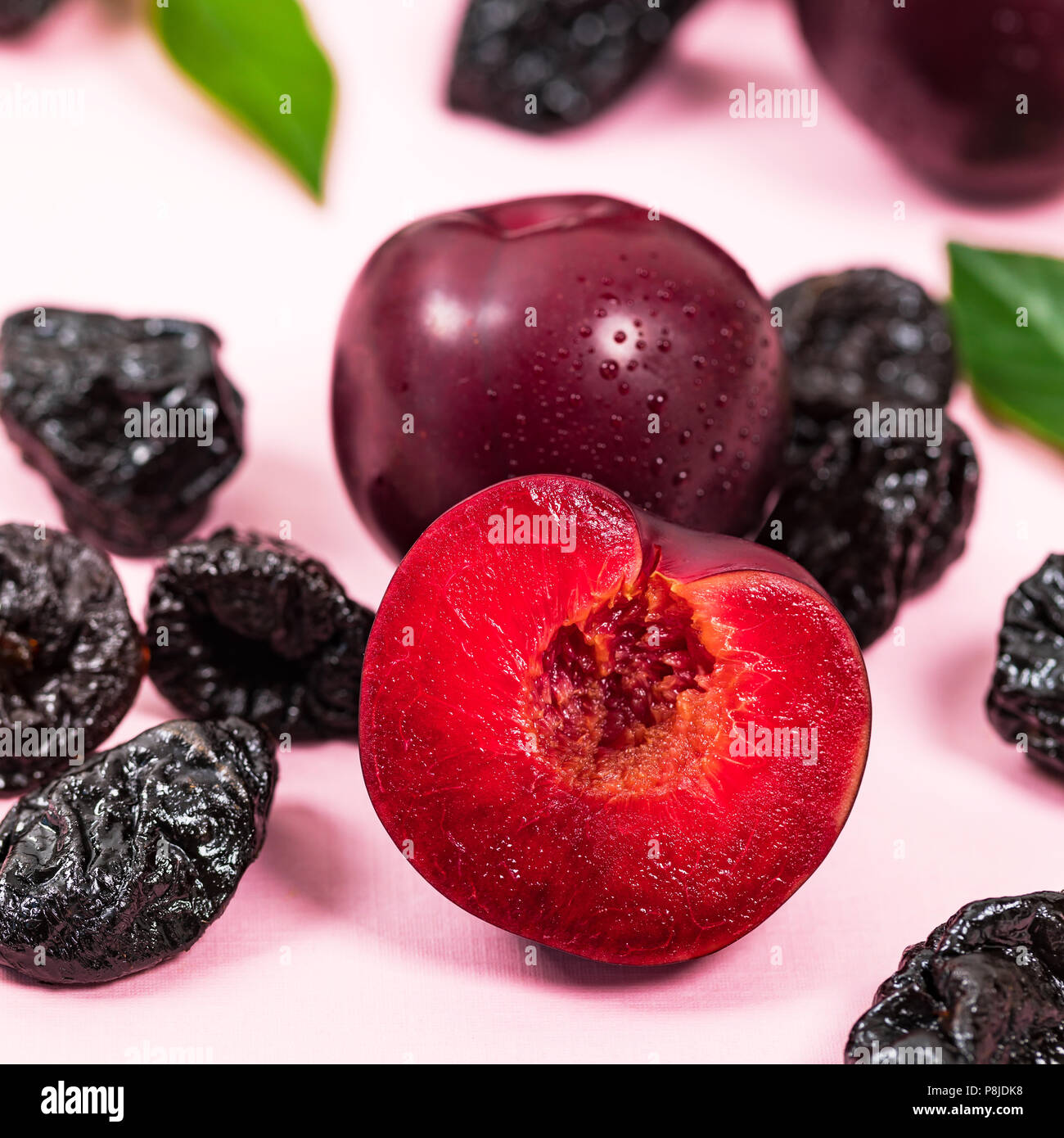 Dried Plums Pitted Prunes and Fresh Plums background Stock Photo Alamy