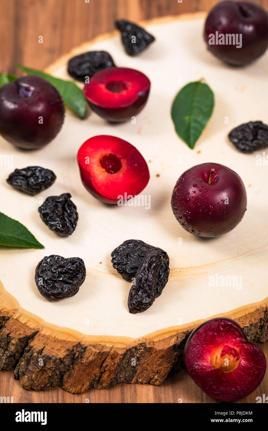 Dried Plums Pitted Prunes and Fresh Plums background Stock Photo Alamy