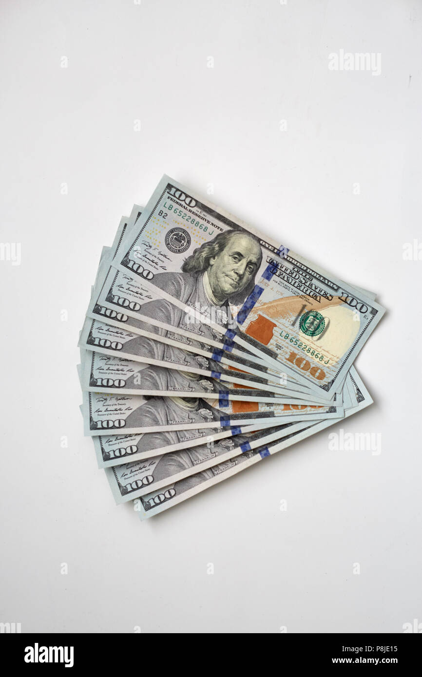 100 dollar banknotes against white background Stock Photo