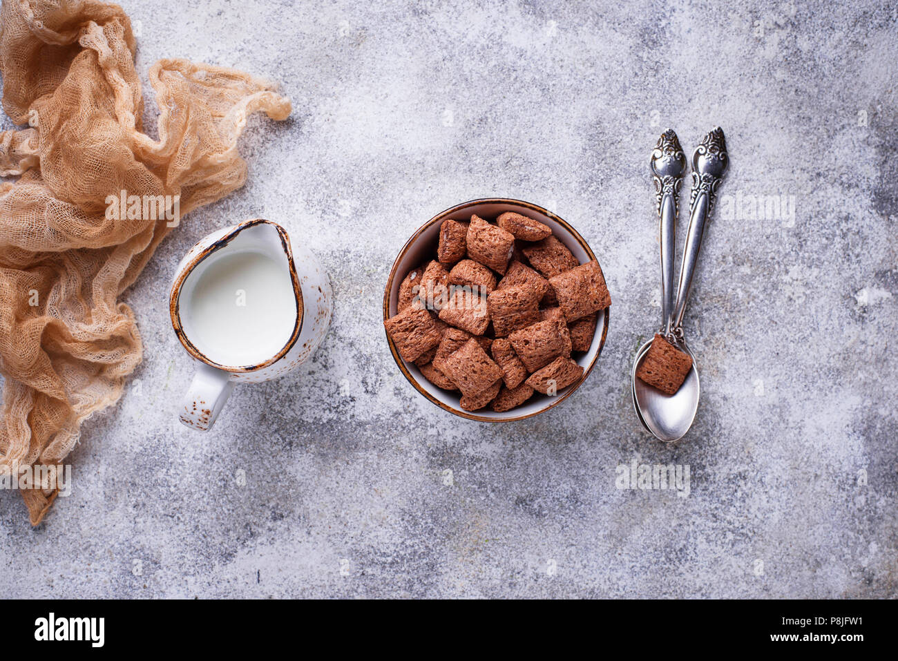 Cocoa puffs corn flakes on light background Stock Photo Alamy