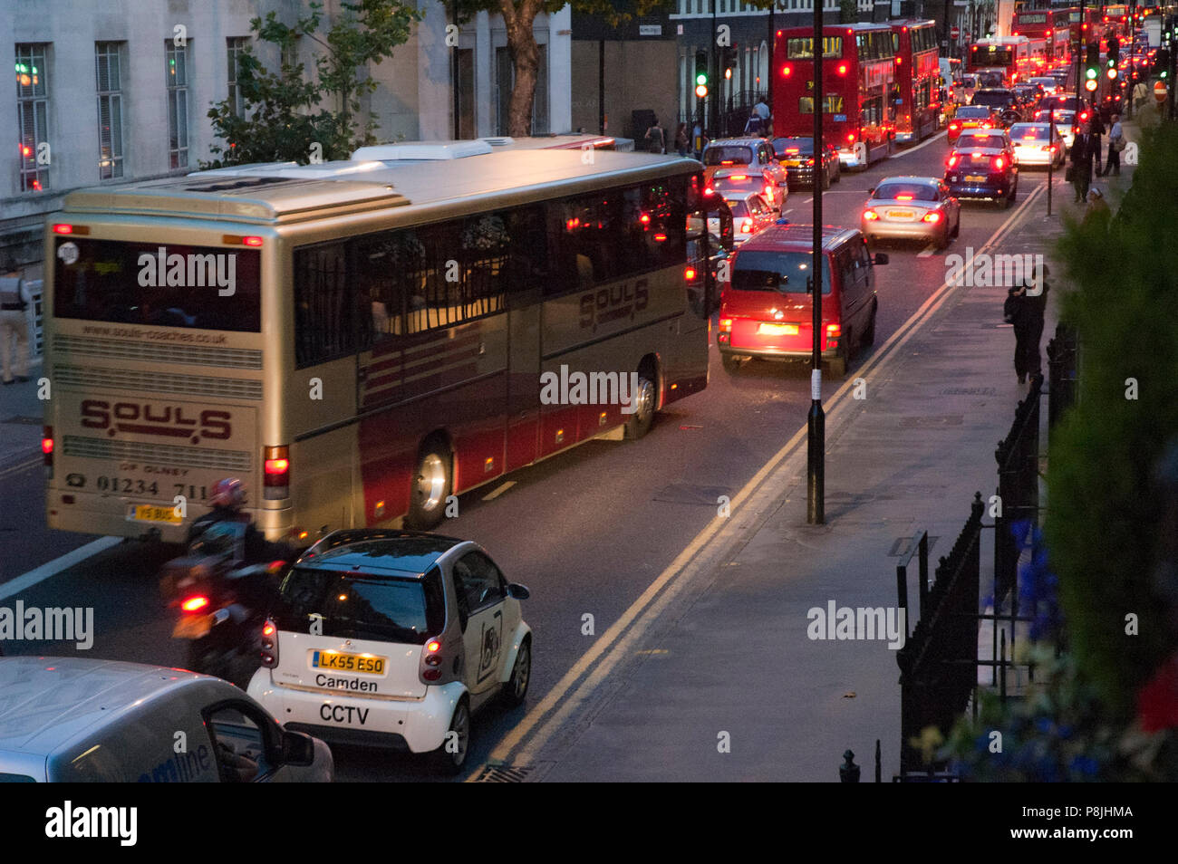 Bus cutting lanes in the early evening traffic congestion on Gower ...