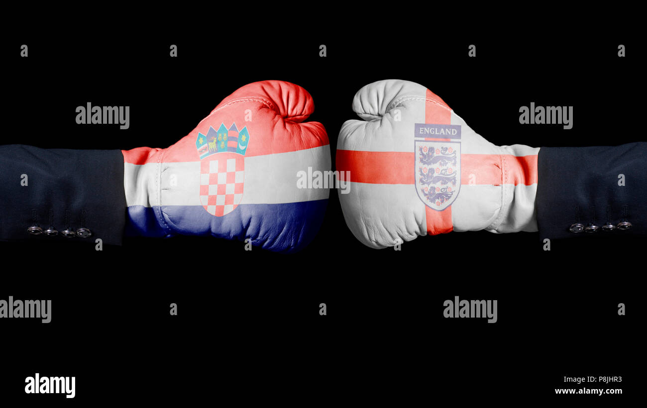 Boxing gloves with Croatia and Three Lions Soccer England National Football Team flag. Croatia versus UK concept on black Stock Photo