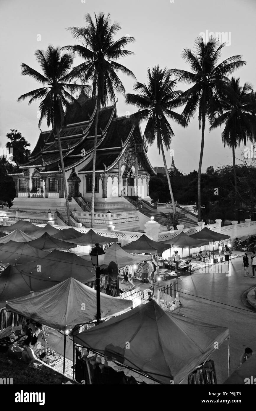 The HAW PHA BANG or Royal Temple sits above the famous NIGHT MARKET - LUANG PRABANG, LAOS Stock Photo