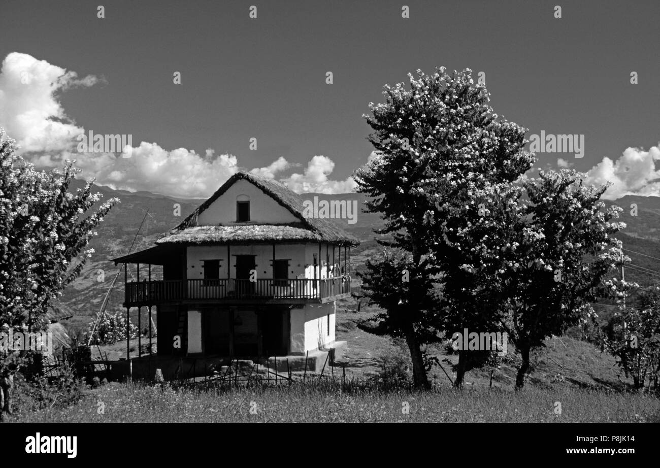 Two storied NEPALI STYLE HOUSE in the middle hills on route to the MAKALU BARUN NATIONAL PARK - EASTERN, NEPAL Stock Photo