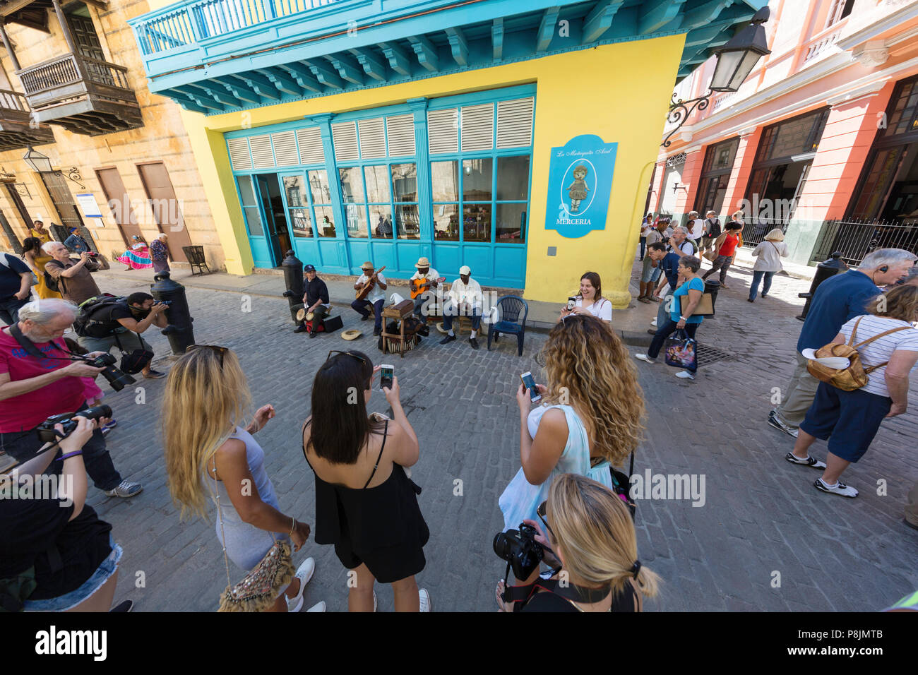 Street musicians  performing for a crowd in old Havana, Cuba Stock Photo