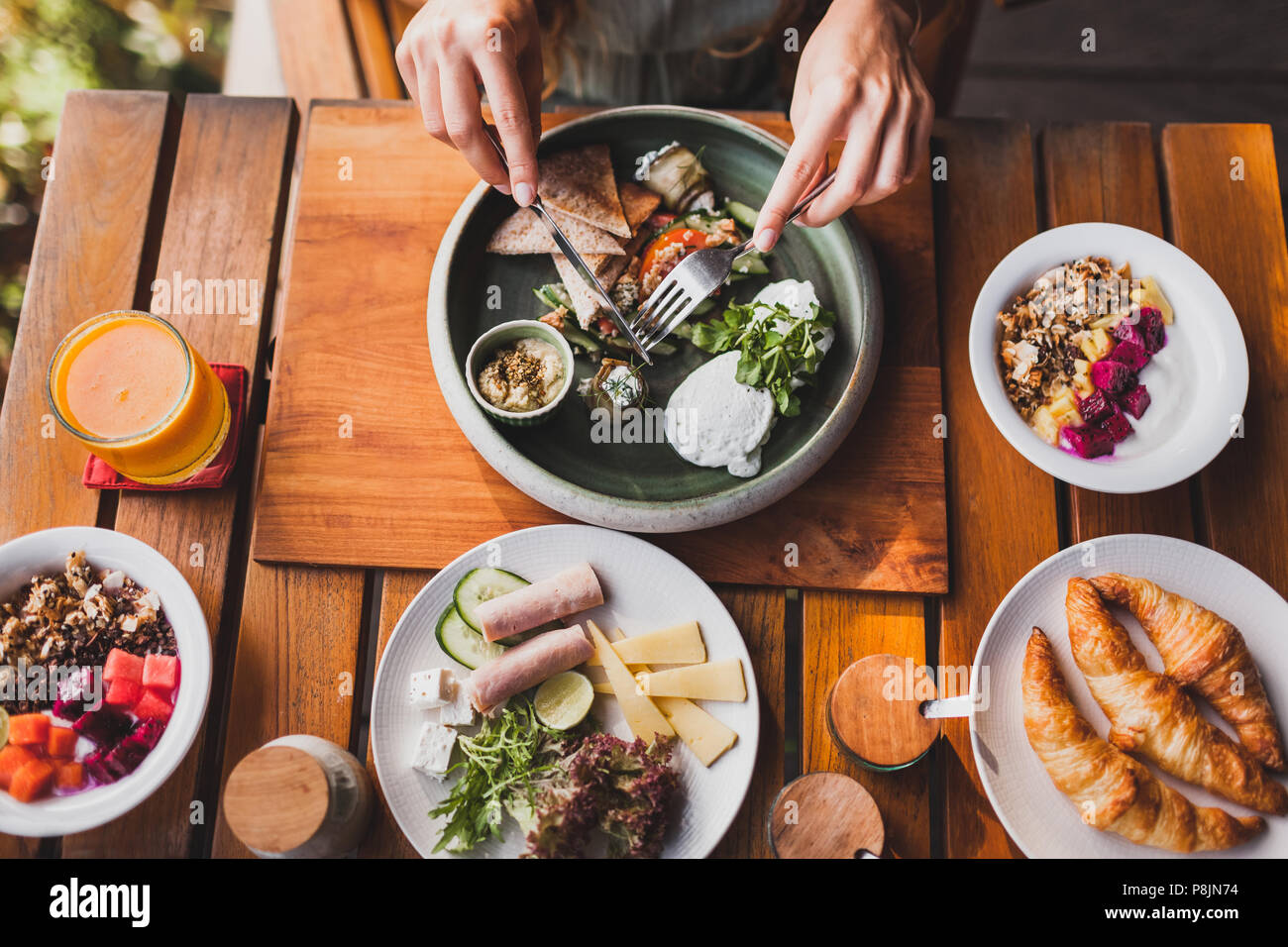 Girl holding up knife fork hi-res stock photography and images - Alamy
