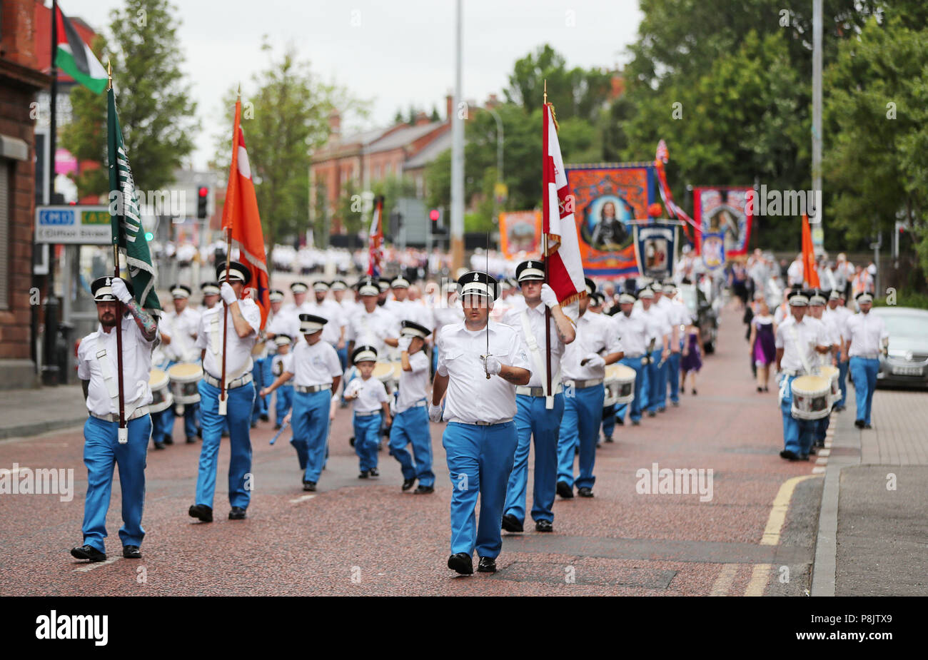 Bandsmen and Orange order members take part in the annual Twelfth of July celebrations in Belfast city centre, marking the victory of King William III's victory over James II at the Battle of the Boyne in 1690. Stock Photo