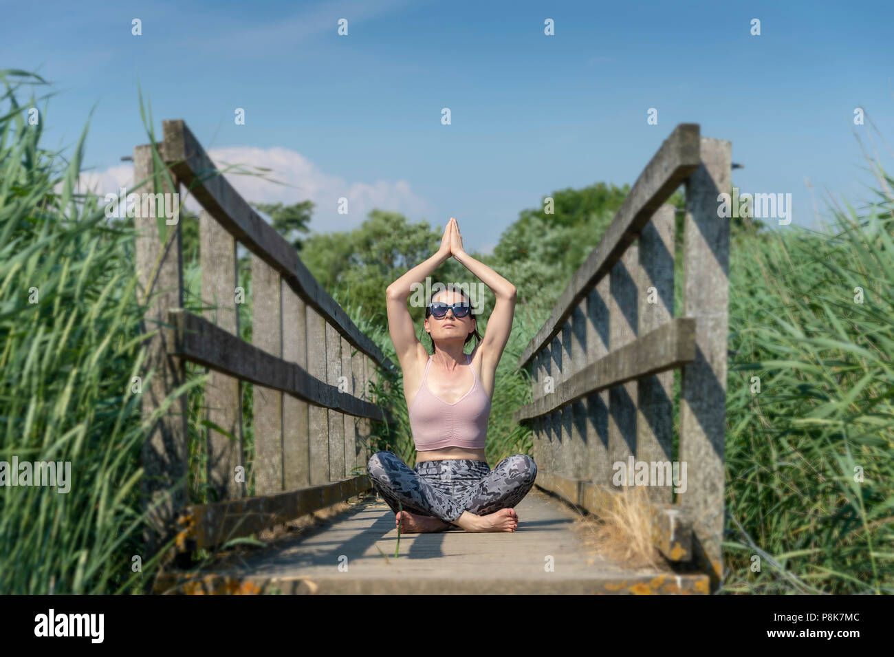 Sitting on a wooden bridge hi-res stock photography and images - Alamy