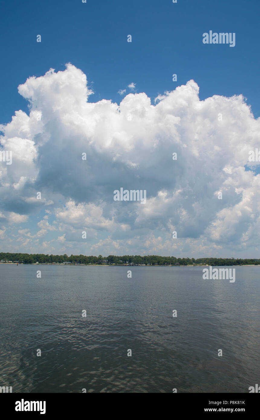 Cumulus clouds rise over the Pamlico Sound on a Ferry Trip in North Carolina Stock Photo